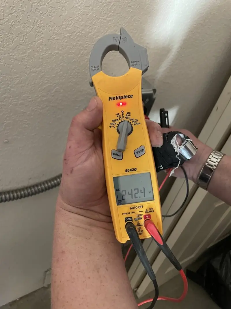 Voltage testing with clamp meter during Whole House Surge Protector in Batesville